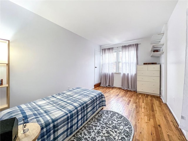 bedroom with light hardwood / wood-style floors