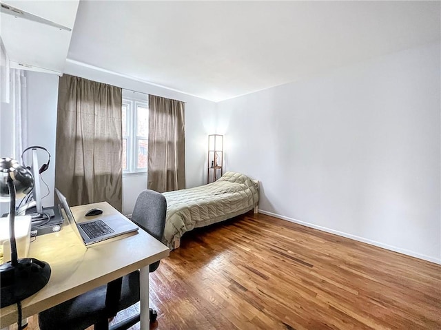 bedroom featuring hardwood / wood-style floors