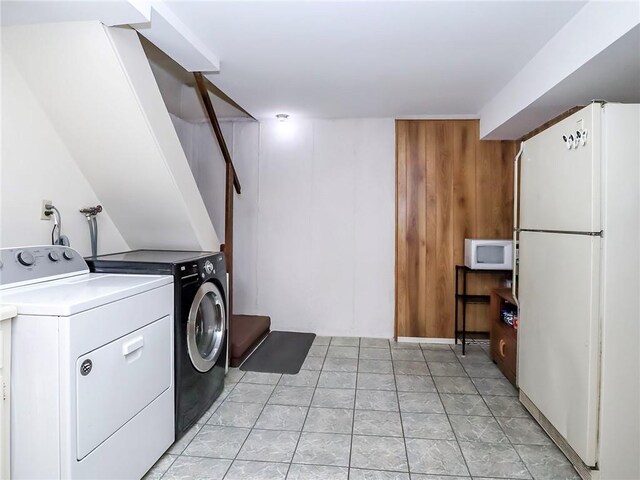 laundry room featuring washing machine and clothes dryer