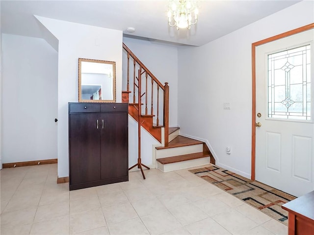 entrance foyer featuring an inviting chandelier