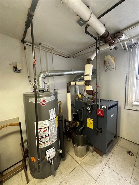 utility room featuring gas water heater