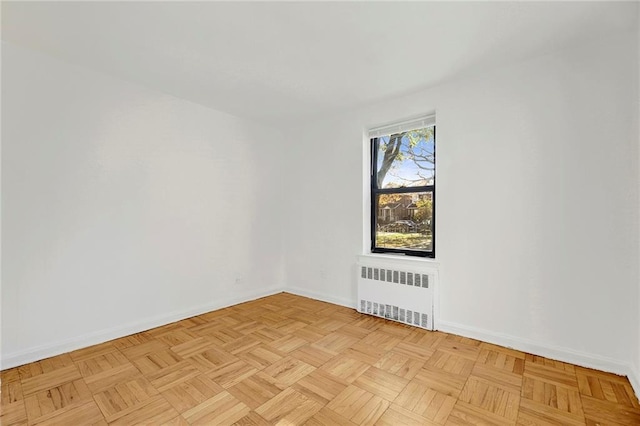 35 Oliver St Unit 1D, Brooklyn, NY 11209 - spare room featuring radiator and baseboards