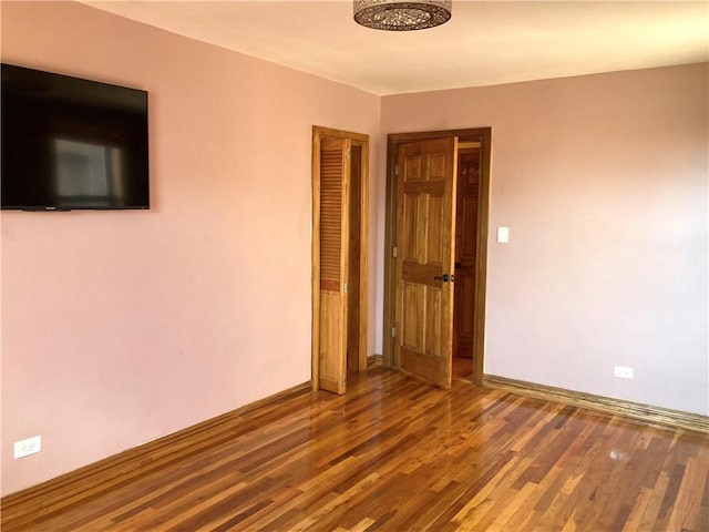 unfurnished room featuring hardwood / wood-style floors