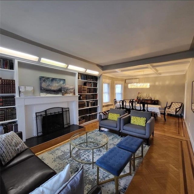 living room featuring built in shelves and parquet flooring