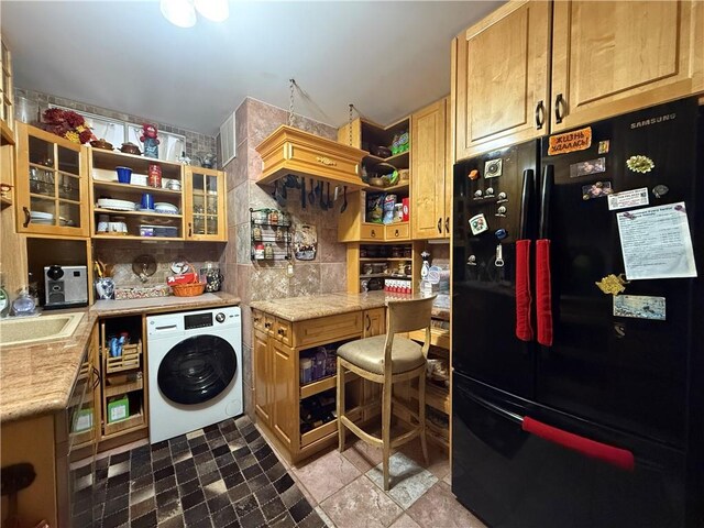 washroom featuring washer / clothes dryer and sink