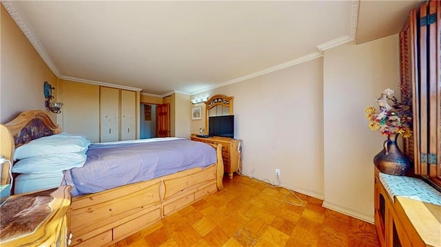 bedroom featuring crown molding, a closet, and light parquet floors