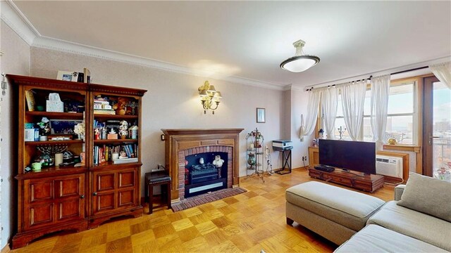 living room with crown molding, a fireplace, a wall mounted AC, and light parquet flooring