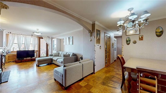 living room featuring ornamental molding and a chandelier