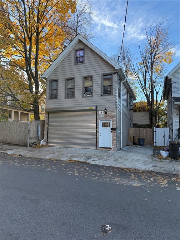 front of property with a garage