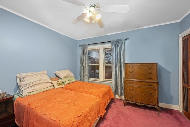 bedroom featuring ceiling fan, ornamental molding, carpet flooring, and a closet