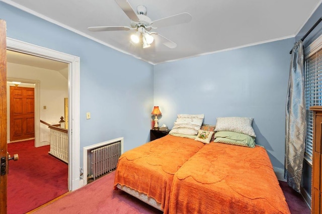 carpeted bedroom with ornamental molding, ceiling fan, and radiator heating unit