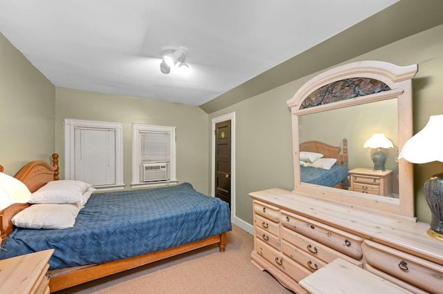 bedroom featuring lofted ceiling, carpet floors, and cooling unit