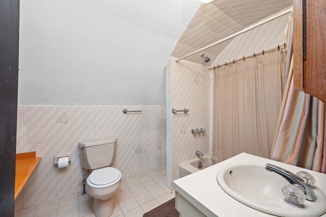 full bath with toilet, tile patterned flooring, shower / bath combination with curtain, vanity, and tile walls