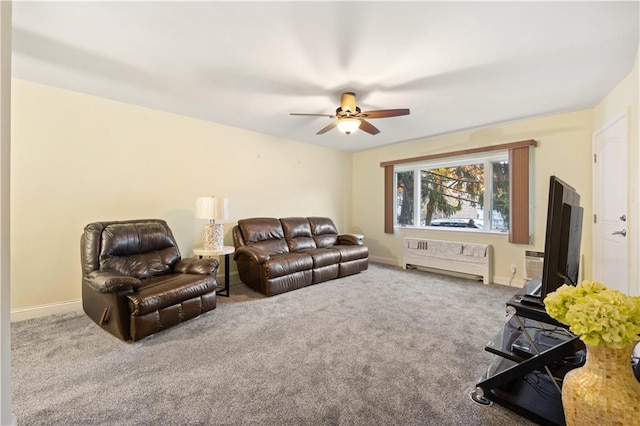 carpeted living room featuring radiator and ceiling fan