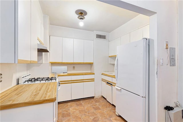 kitchen featuring white appliances and white cabinetry