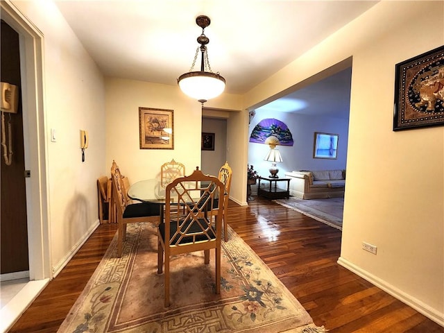 dining space featuring dark hardwood / wood-style floors