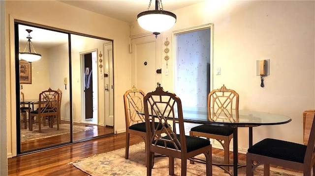 dining area featuring hardwood / wood-style flooring