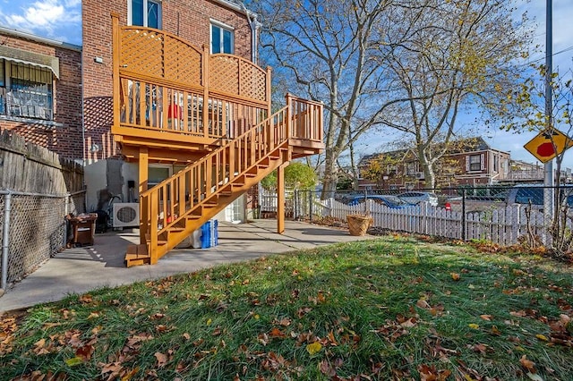 back of property with a patio area, a yard, and ac unit