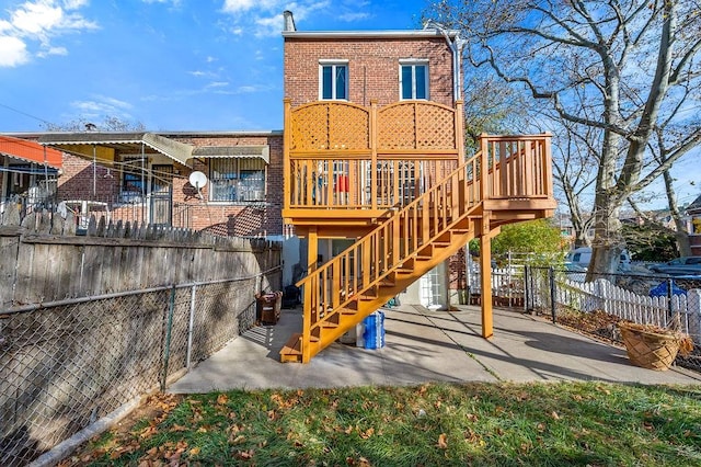 back of property featuring a patio