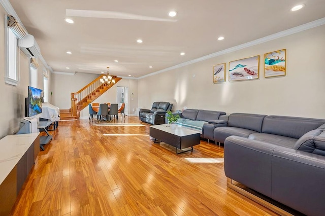 living room featuring an inviting chandelier and crown molding