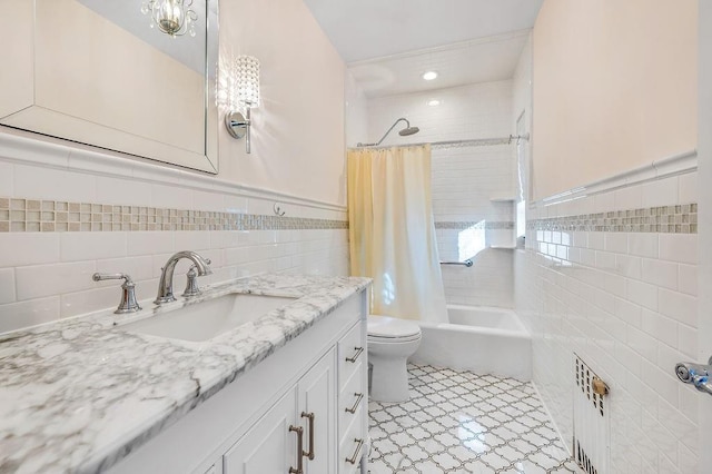 full bathroom featuring tile patterned flooring, vanity, tile walls, toilet, and shower / tub combo with curtain