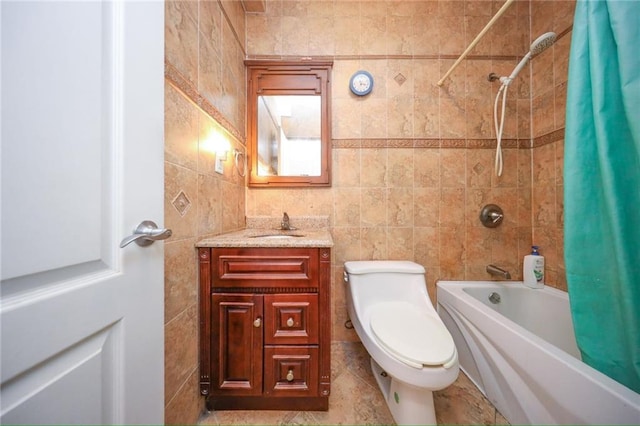 full bathroom with toilet, shower / bath combo, tile patterned flooring, tile walls, and vanity