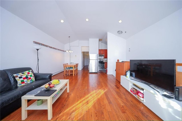 living area featuring lofted ceiling, light wood finished floors, and recessed lighting