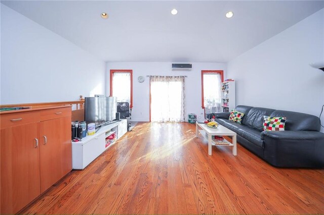 living room with light hardwood / wood-style flooring