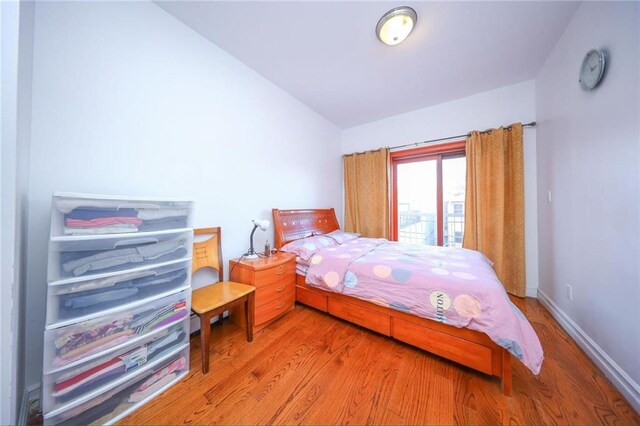 bedroom featuring wood-type flooring