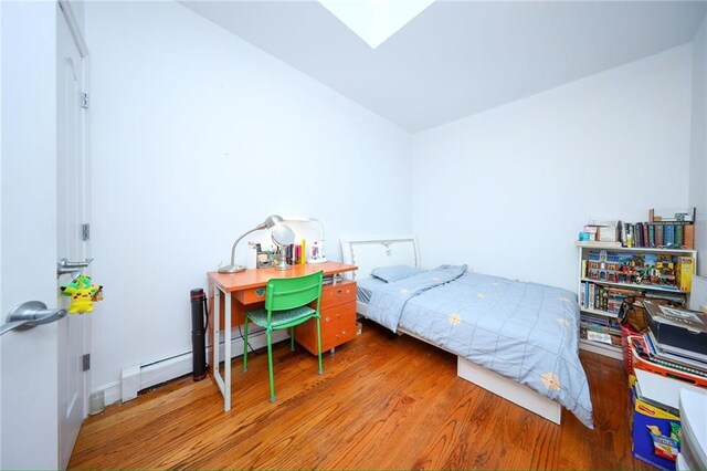 bedroom with wood-type flooring