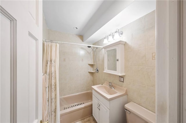 full bathroom featuring vanity, tile walls, shower / tub combo, and toilet