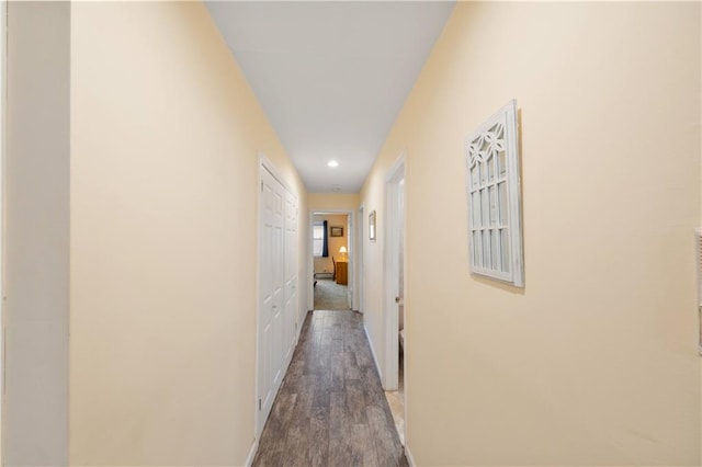 corridor with wood-type flooring