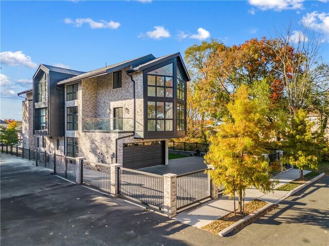 view of side of home featuring a garage