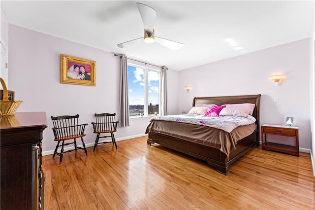 bedroom with ceiling fan and light wood-type flooring