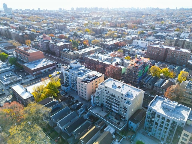 birds eye view of property with a view of city