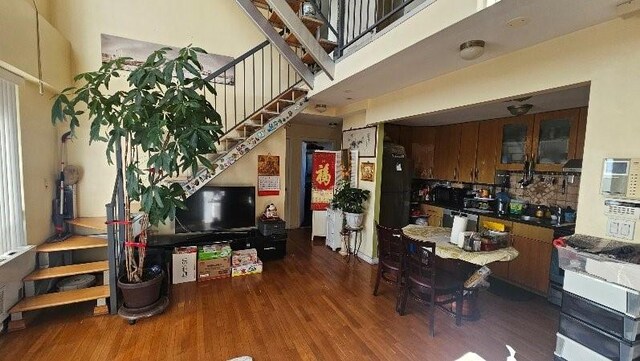 6422 Bay Pkwy Unit 6B, Brooklyn, NY 11204 - dining space featuring wood finished floors and stairway