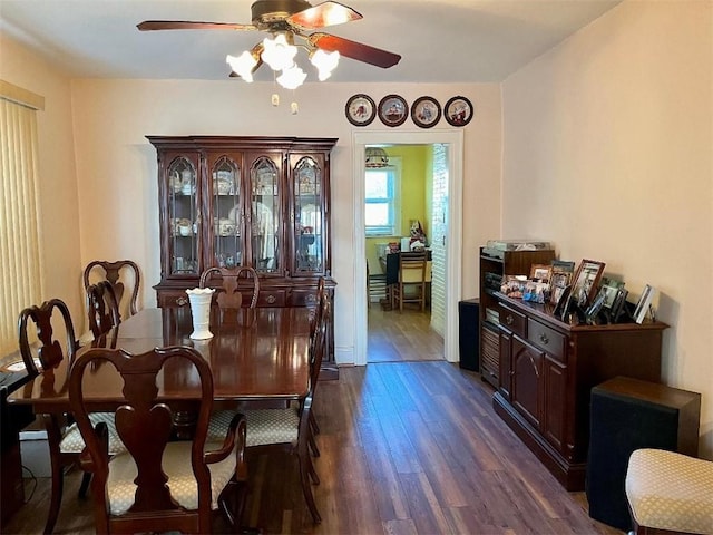 dining room with dark wood-style floors and ceiling fan