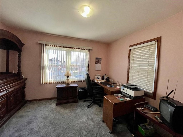 home office featuring baseboards and light colored carpet