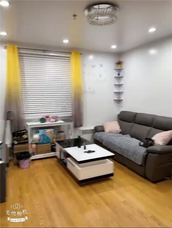 living room with light hardwood / wood-style flooring