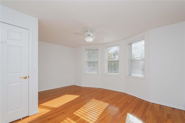 unfurnished room with ceiling fan and light hardwood / wood-style flooring