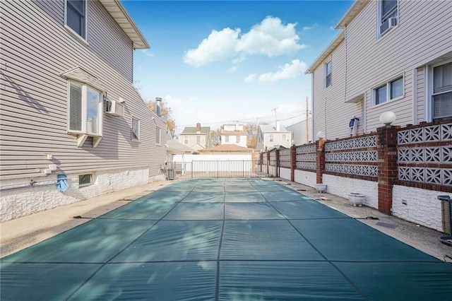 view of pool featuring fence