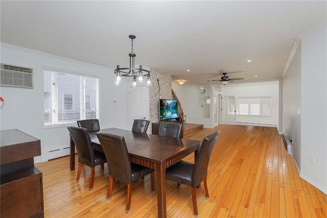 dining room with ornamental molding, ceiling fan with notable chandelier, baseboard heating, a wall mounted AC, and light hardwood / wood-style flooring