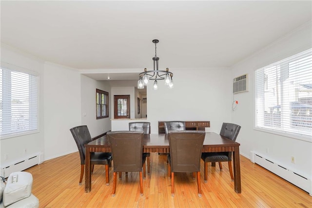 dining room featuring light wood-type flooring, an inviting chandelier, an AC wall unit, and a baseboard heating unit