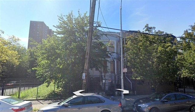view of property featuring fence