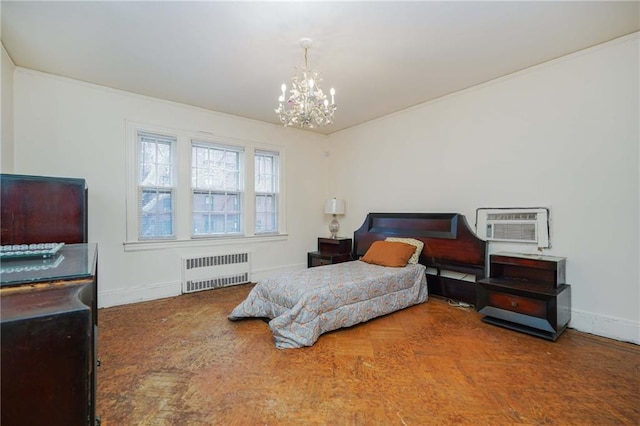 bedroom featuring radiator, a chandelier, baseboards, and a wall mounted air conditioner
