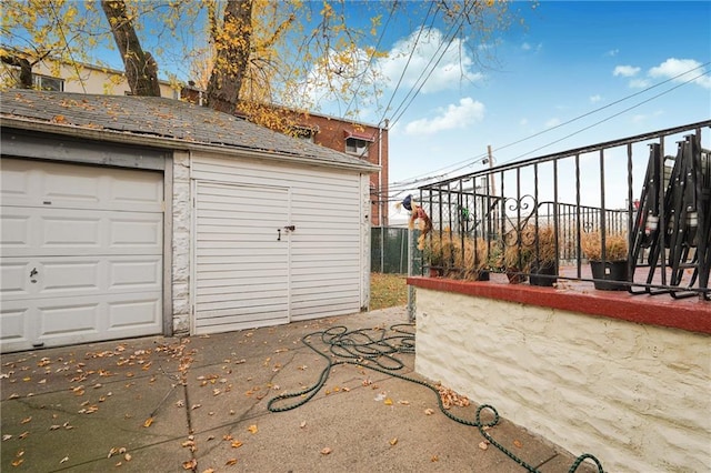 garage with fence
