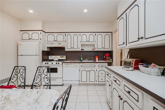 kitchen with white appliances, under cabinet range hood, a sink, light tile patterned floors, and open shelves