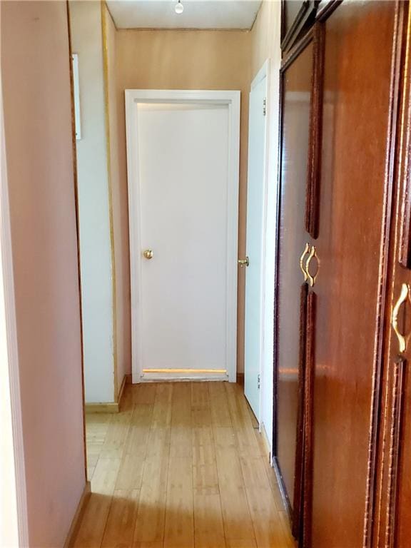 hallway featuring light wood-style flooring