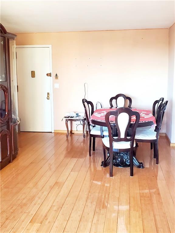 dining space featuring wood-type flooring