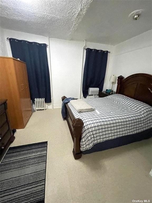 bedroom featuring a textured ceiling